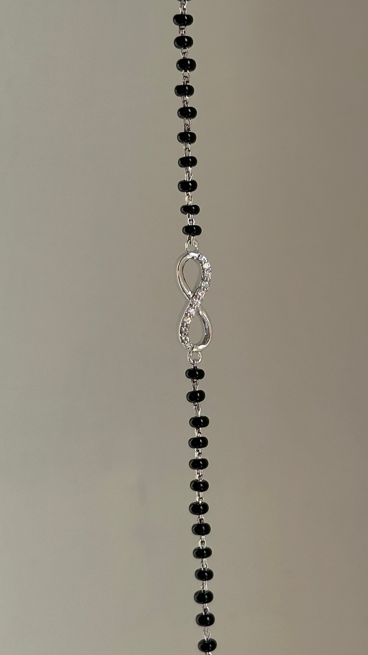 infinity mangalsutra bracelet worn on wrist — 925 silver hand mangalsutra