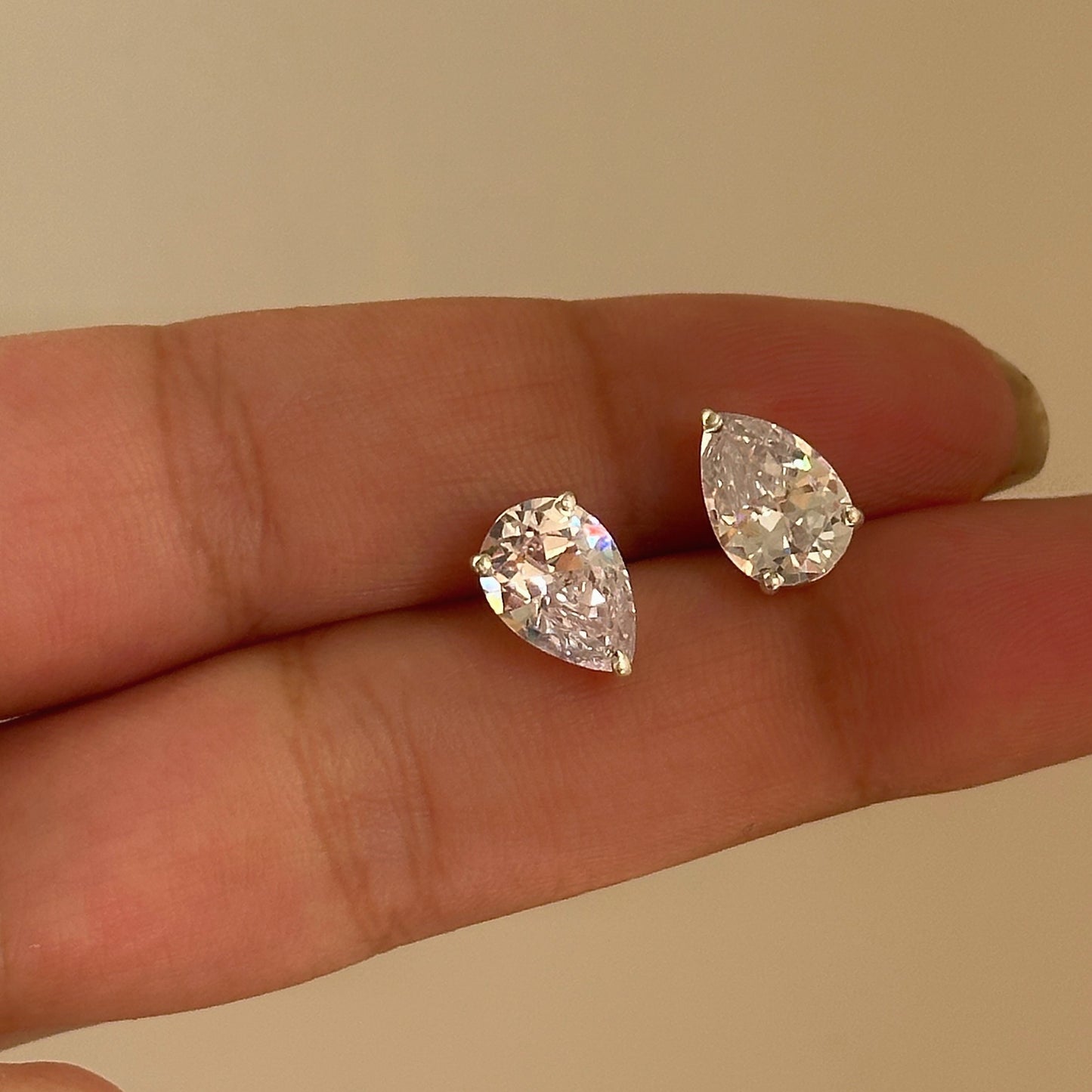 pear cut stud close-up — pear-shaped stone detail in silver setting
