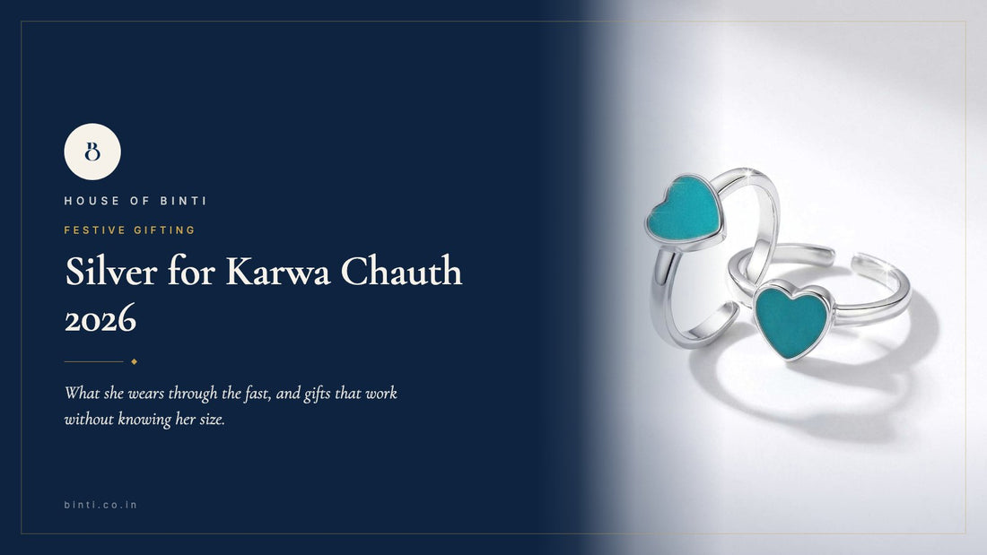 Silver toe rings, a thin payal and a small pendant on red cloth beside a sargi thali for Karwa Chauth 2026