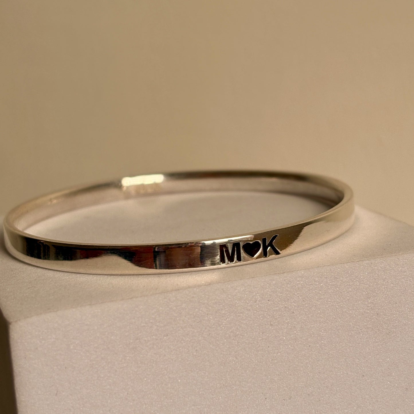 personalized name kada close-up — engraved name detail on silver kada