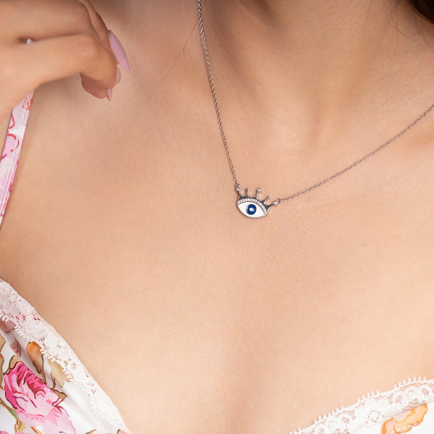 crowned evil eye neckpiece