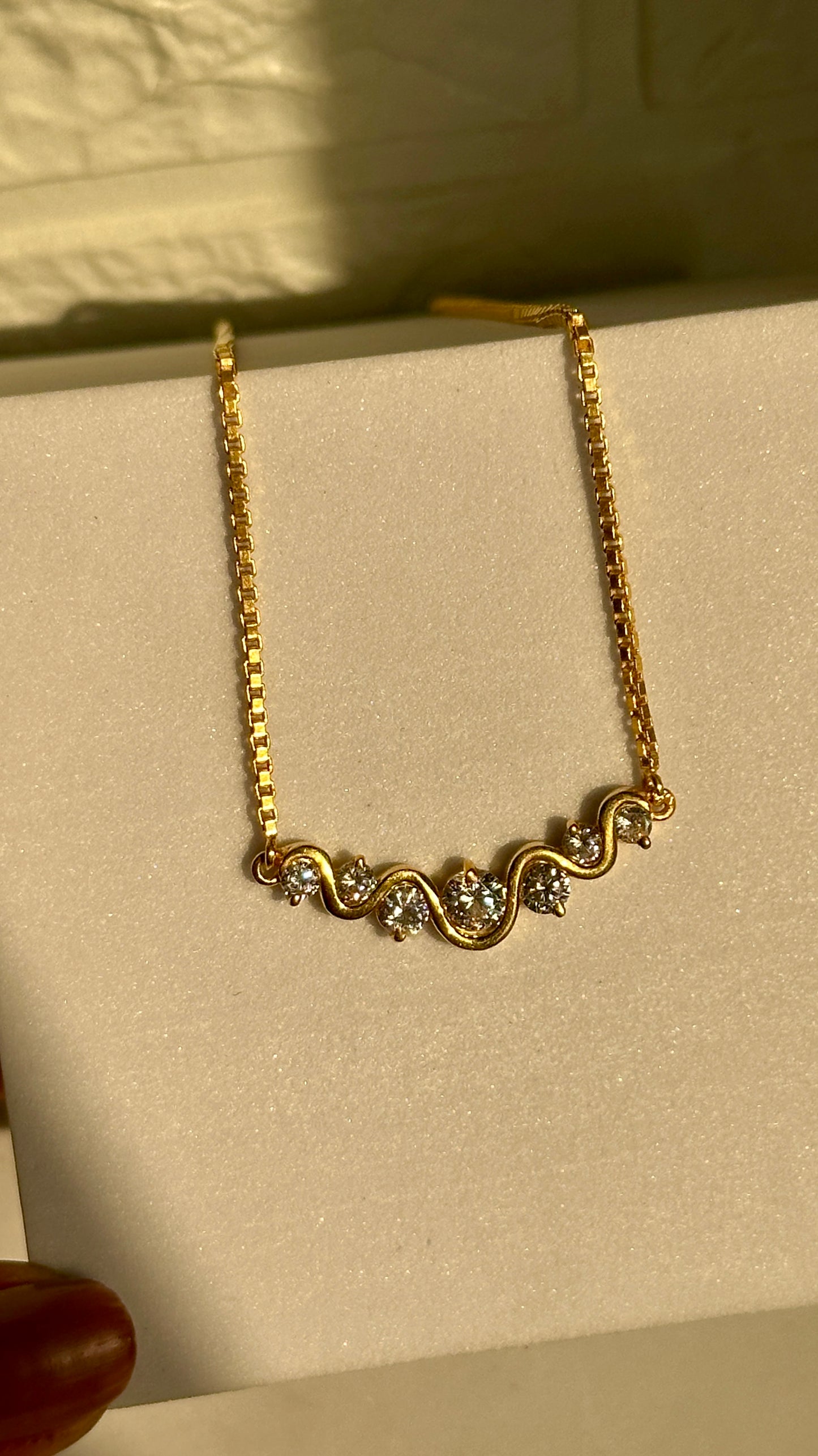 wavy spark neckpiece