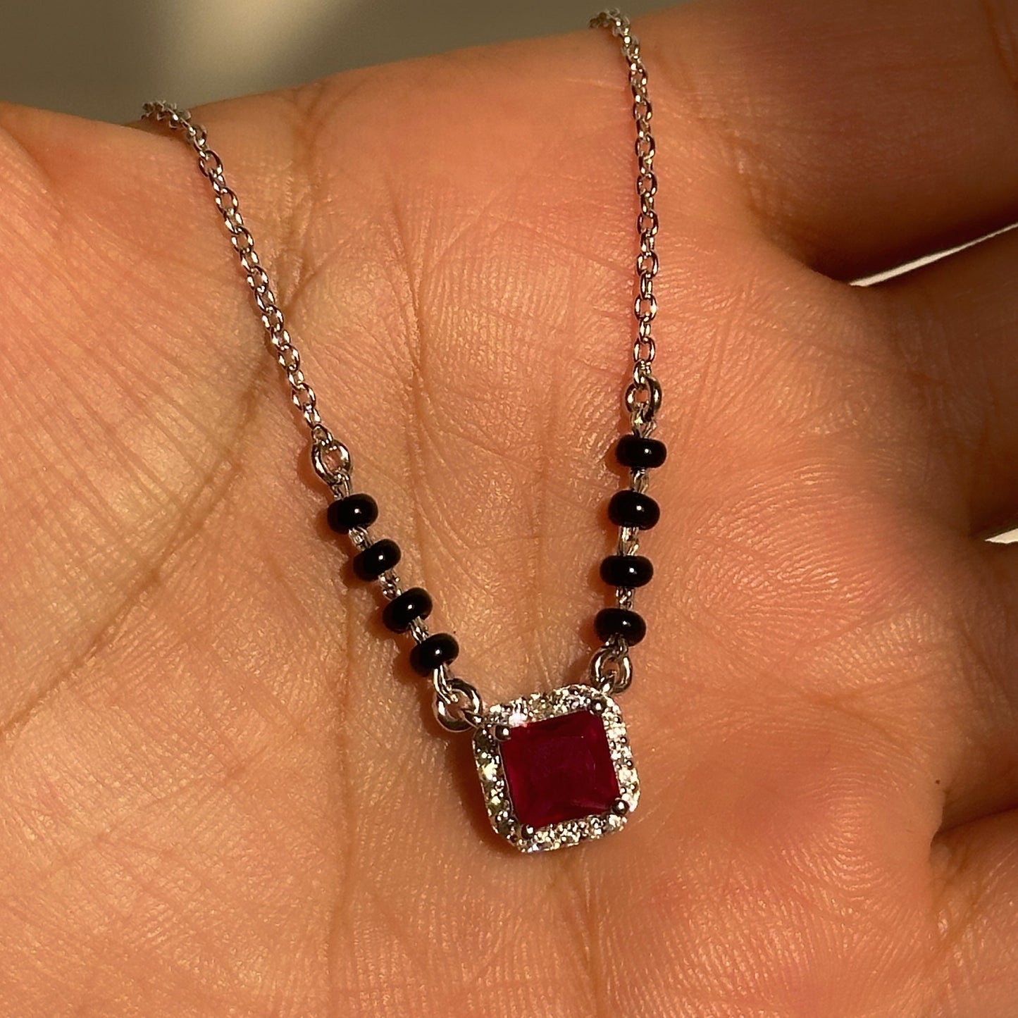 royal ruby mangalsutra in 925 sterling silver with ruby-toned halo pendant, house of binti