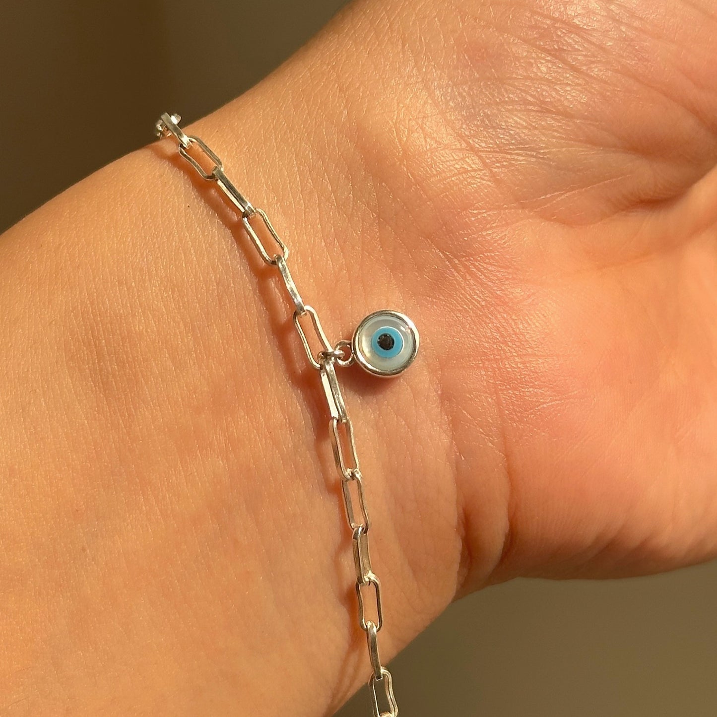 evil eye charm bracelet in 925 sterling silver with dangling nazariya on paperclip chain, house of binti