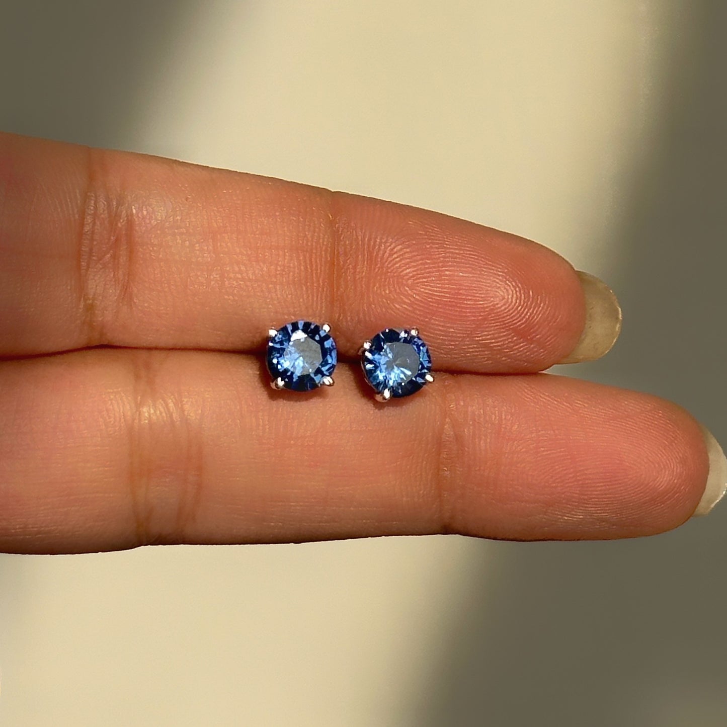 sapphire glow studs 6mm close-up — small round blue stone detail