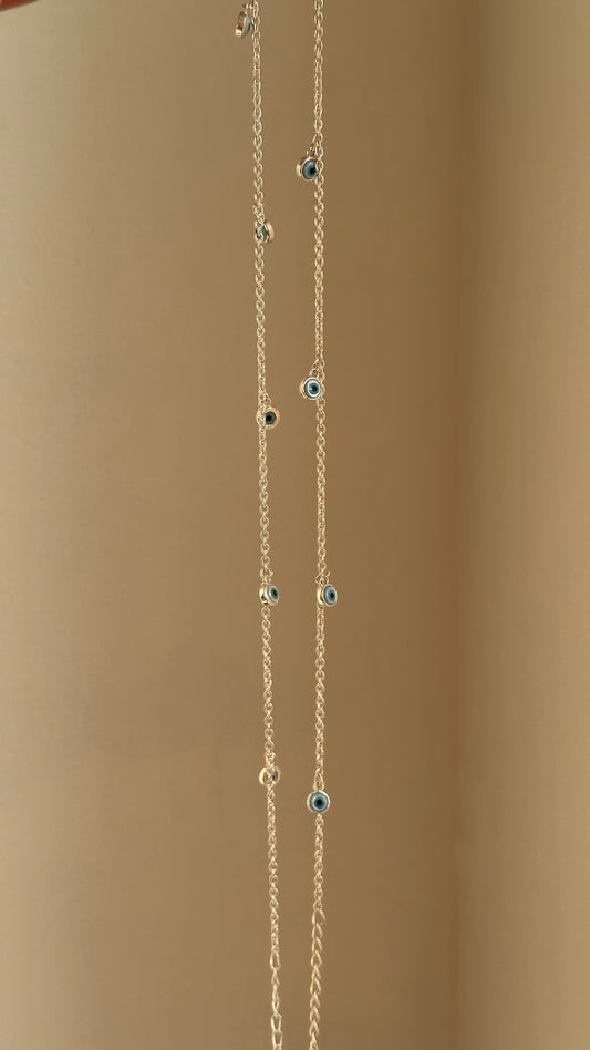 Evil Eye Dangle Anklet close-up — dangling blue evil eye charms