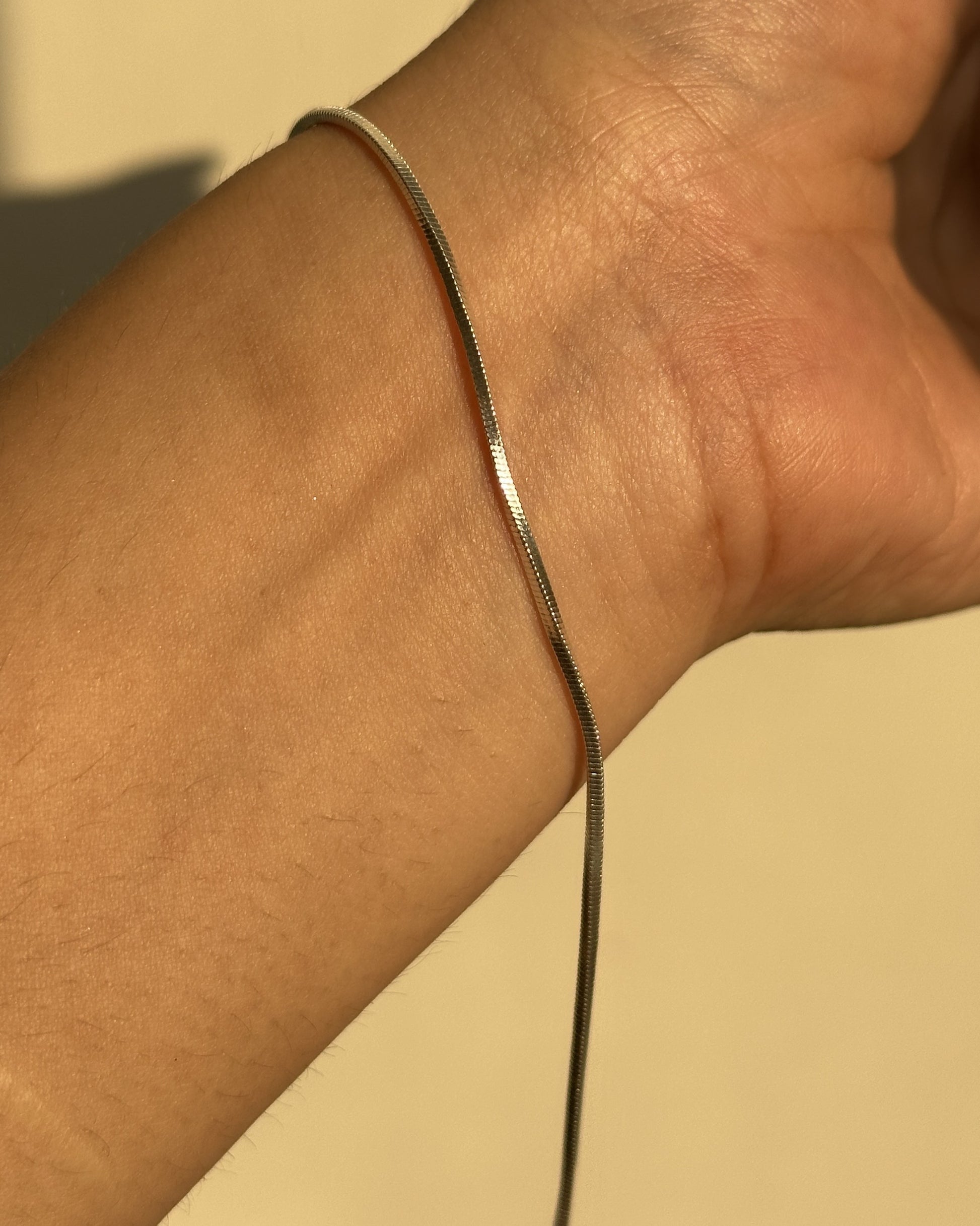 Sleek Snake Bracelet worn on wrist — 925 silver snake chain bracelet