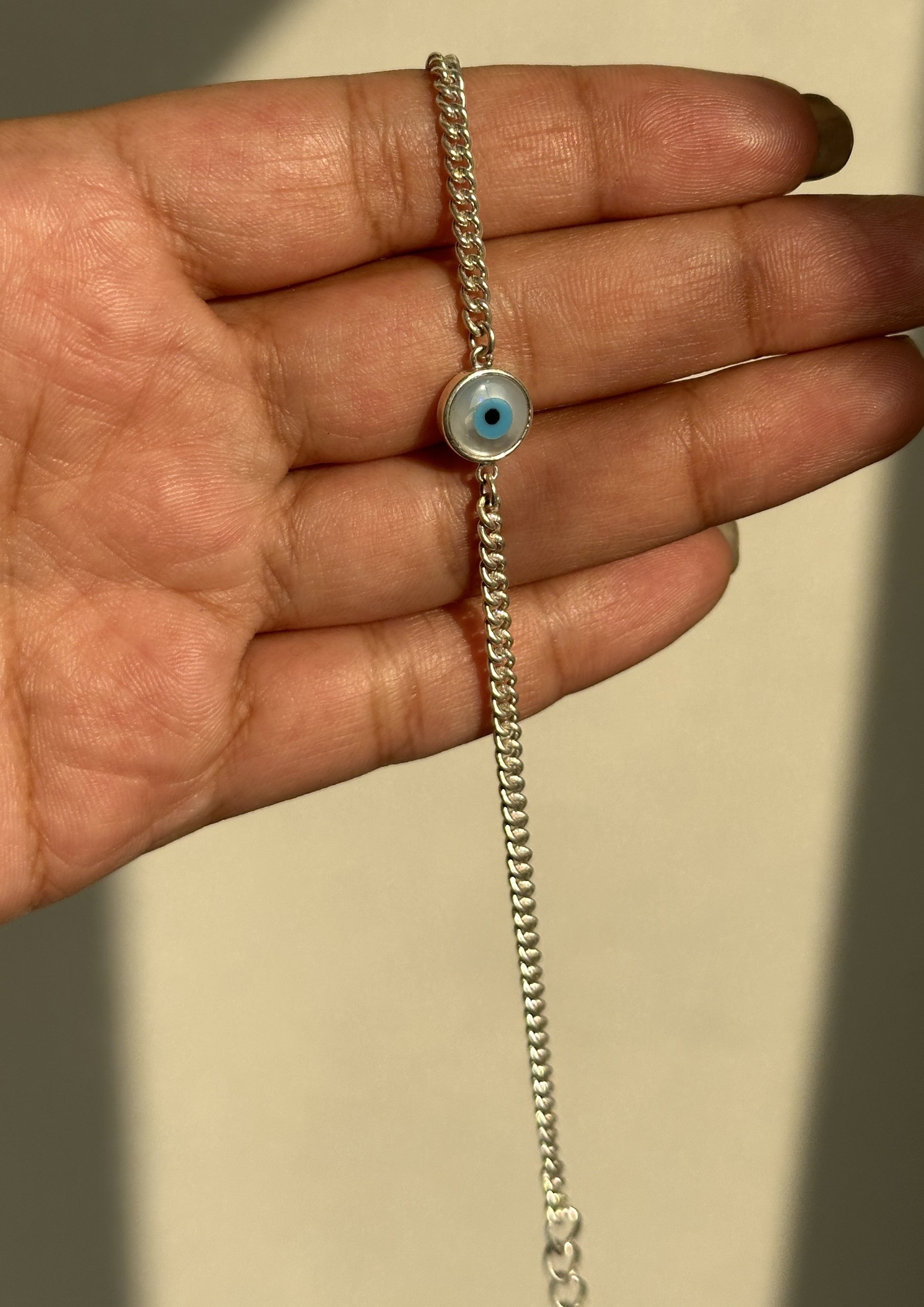 Good Vibes Bracelet worn on wrist — 925 silver evil eye bracelet