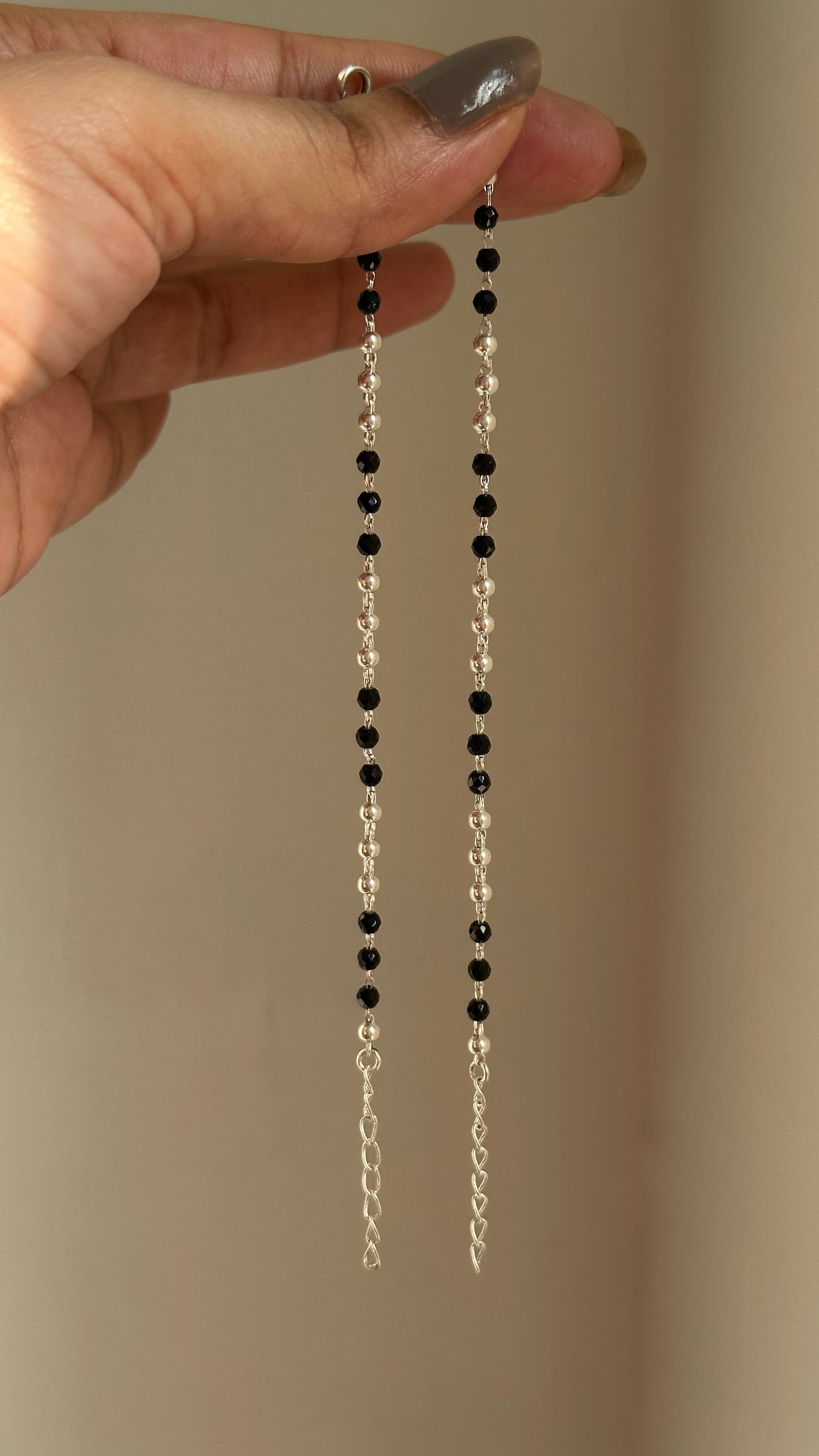 tiny black bead anklet close-up — black beads and silver balls detail