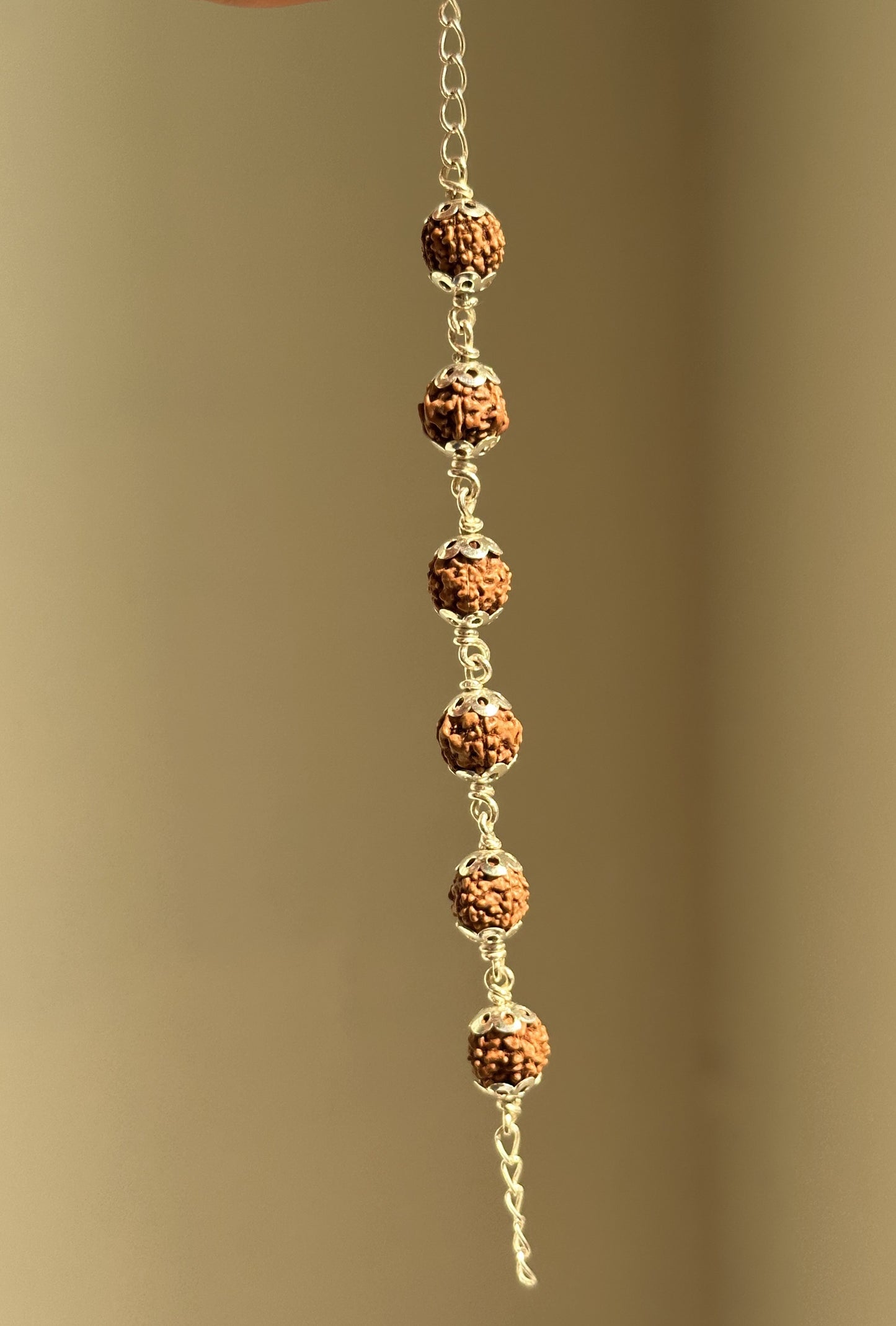 rudra grace bracelet close-up — linked rudraksha and silver detail