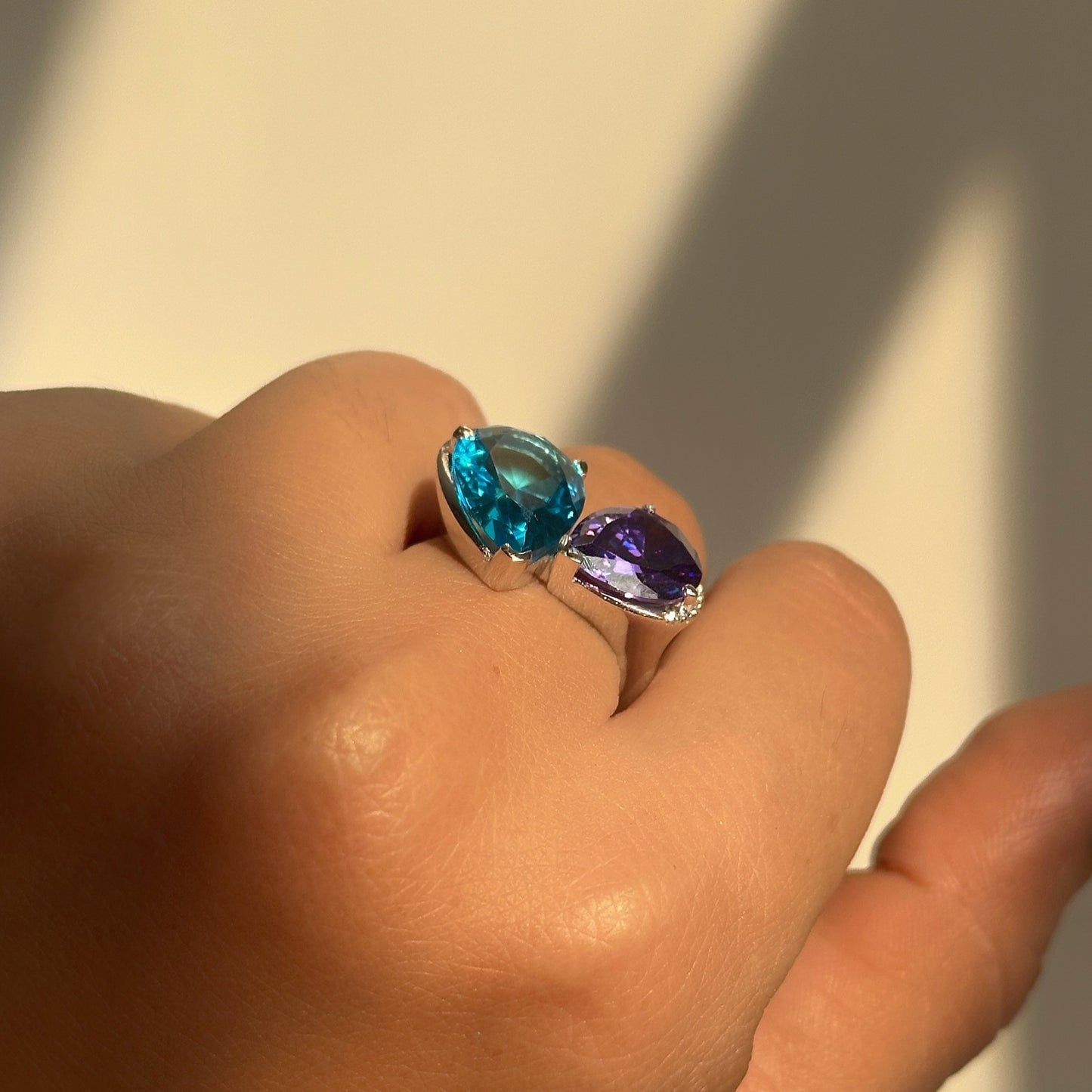 mystic duo ring close-up — blue and purple dual-stone setting detail