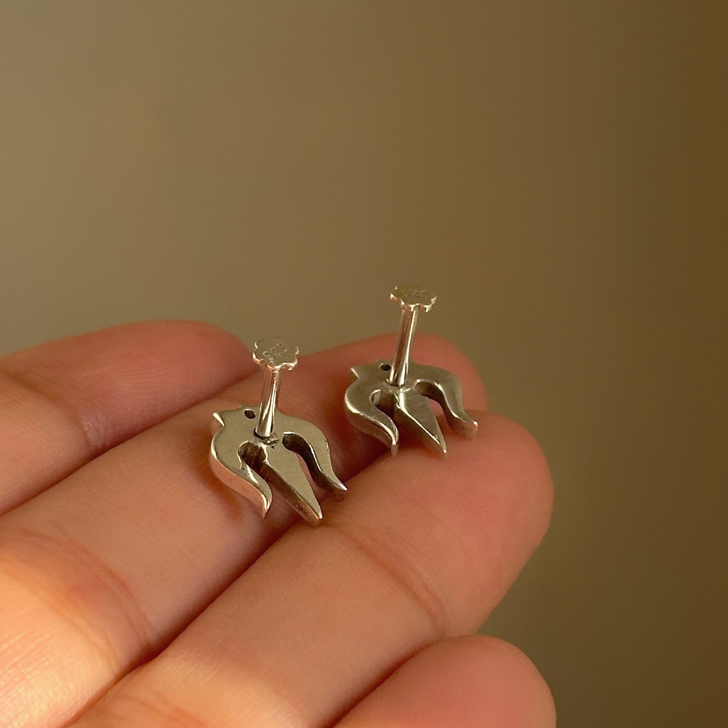 trishul damru studs close-up — detailed trishul and damru motif