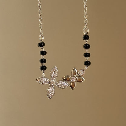 Bloom Grace Mangalsutra — twin floral motifs in 925 silver with black beads