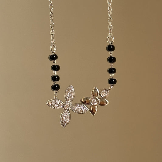 Bloom Grace Mangalsutra — twin floral motifs in 925 silver with black beads