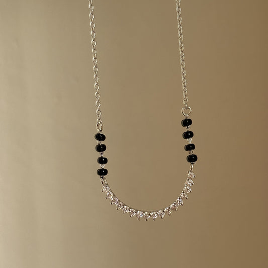 Spark Curve Mangalsutra — U-shaped stone motif in 925 silver with black beads