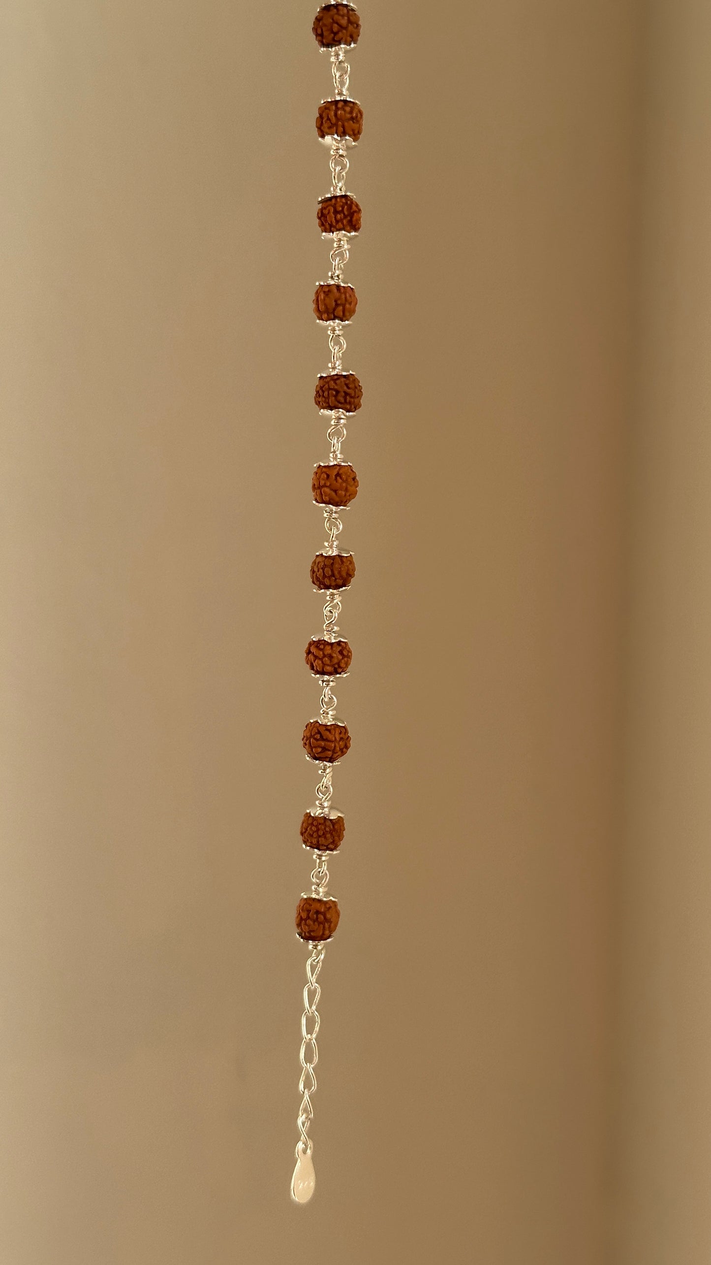 rudra grace bracelet close-up — rudraksha bead and silver accent detail