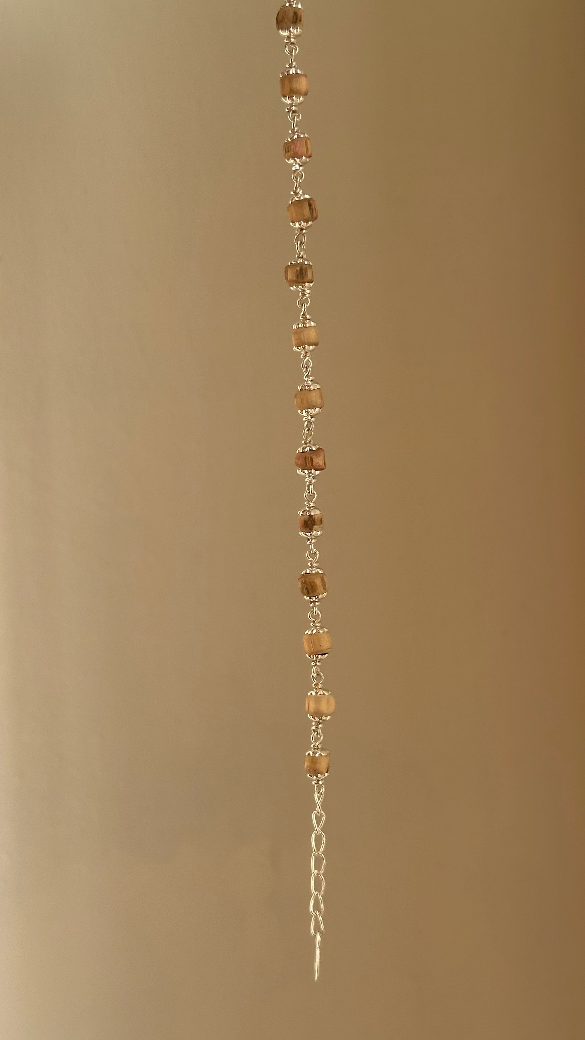 Sacred Tulsi Bracelet worn on wrist — 925 silver tulsi bead bracelet