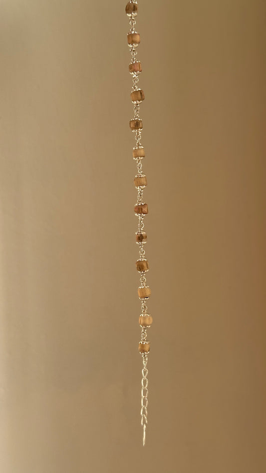 Sacred Tulsi Bracelet worn on wrist — 925 silver tulsi bead bracelet