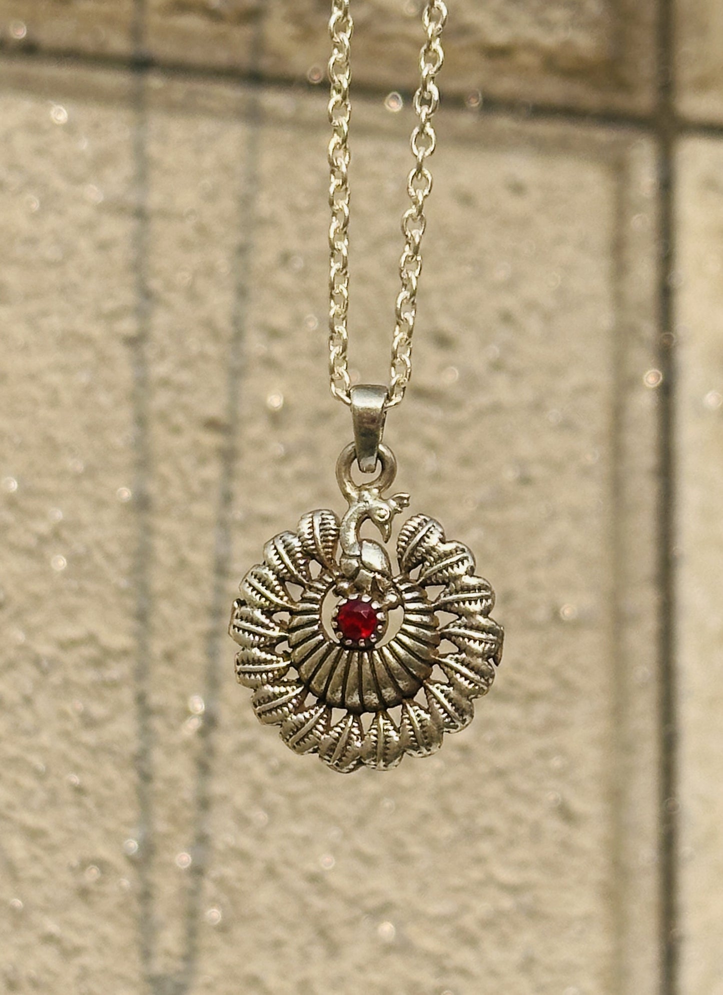 dancing peacock pendant